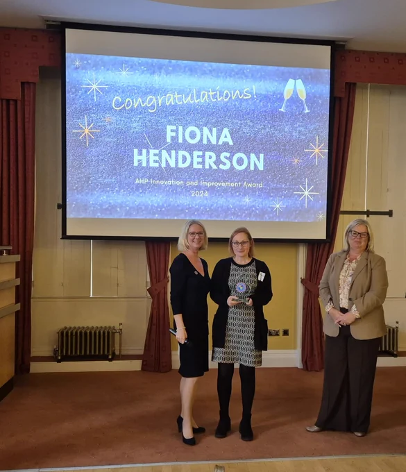 Picture of Fiona Henderson receiving an award from Karen Lewis and Sally Roberts
