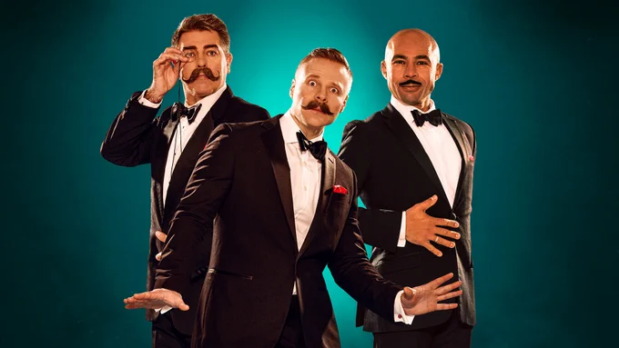 Three men with moustaches in tuxedoes against a blue-green background.