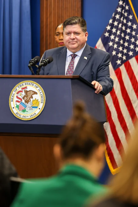 Governor Pritzker speaks behind the podium after the results of the election.