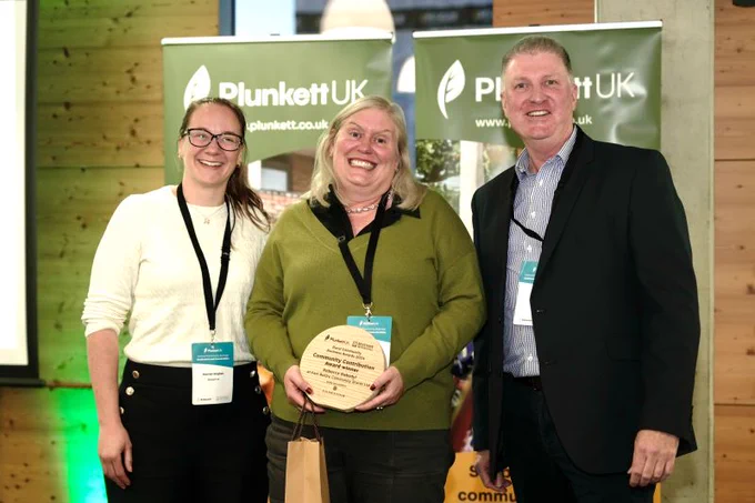 Photo of Rebecca Gabzdyl winner of the Community Contribution Award at Plunkett UK's Rural Community Business Awards 2024
