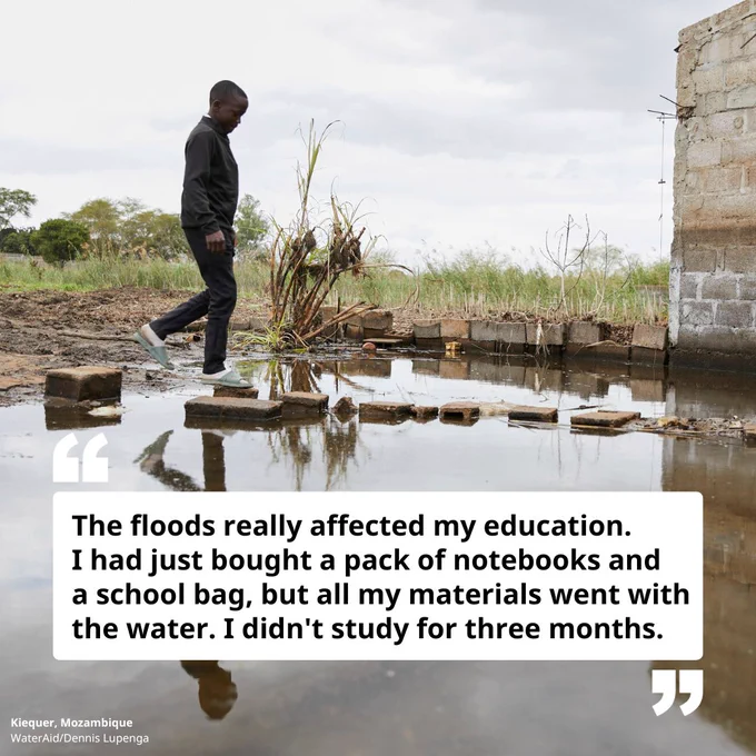 A boy, Kicquer, walks on bricks near his flooded home. He is dressed in all black white white socks and sandals. His quote reads: "The floods really affected my education. I had just bought a pack of notebooks and a school bag, but all my materials went with the water. I didn't study for three months."