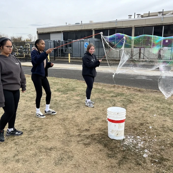 Students experiment during a visit from the Physics Bus