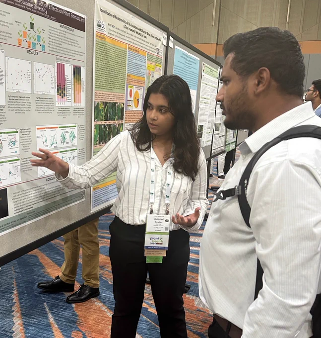 Roshni Sawlani presents her research poster at the Plant Health Conference.