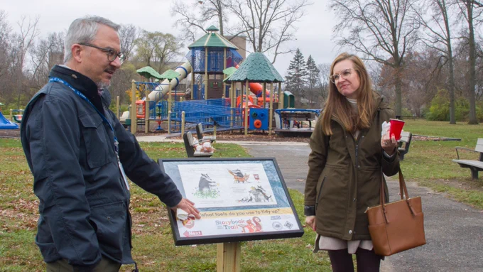 Wayne RESA science consultant Rich Bacolor and Wayne RESA literacy consultant Heather Palmer read the storybook at the ribbon cutting.