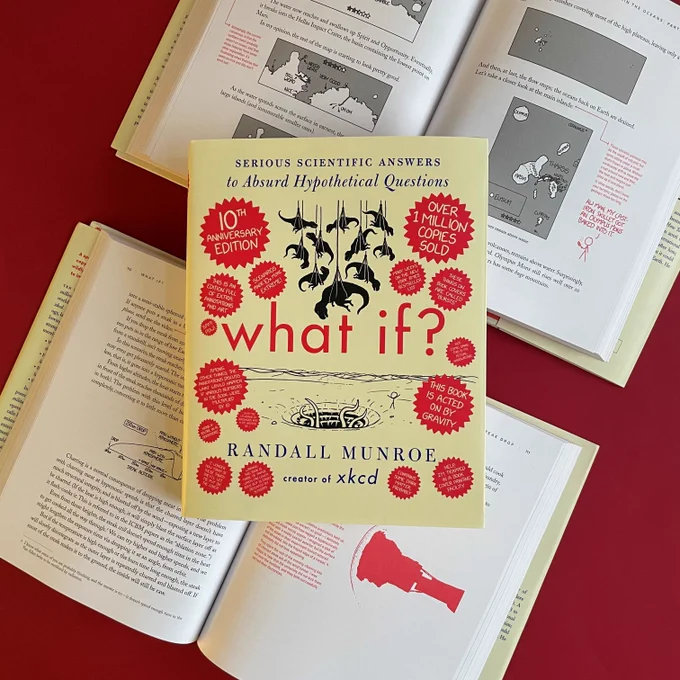 Picture of 10x anniversary edition of WHAT IF? by Randall Munroe on top of two open books showing new art and lengthy annotations.