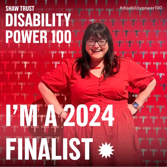 Alt Text:  Shaw Trust Disability Power 100; #DisabilityPower100; I’m a Finalist 2024 Image of Chella Quint in a red dress posing in front of a red wall of silver uterus stamps