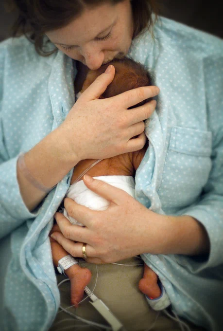 Mother holding newborn baby