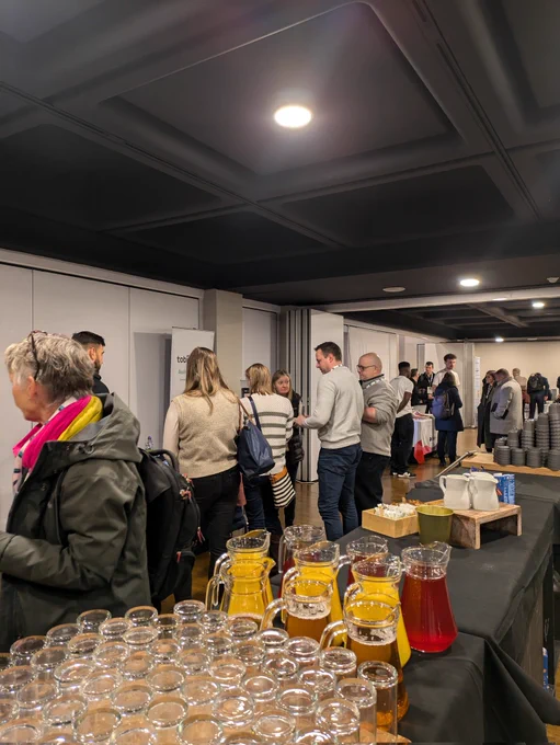 Attendees busy in conversation with exhibitors