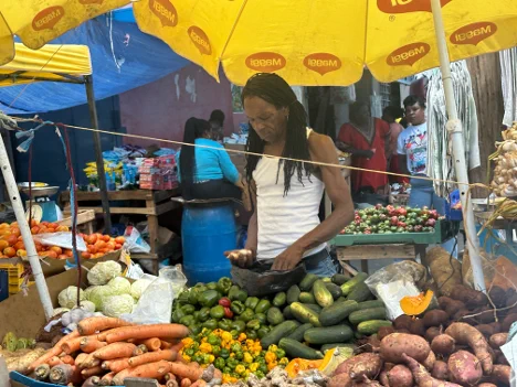 A vegetable vender in Kingston, Jamaica