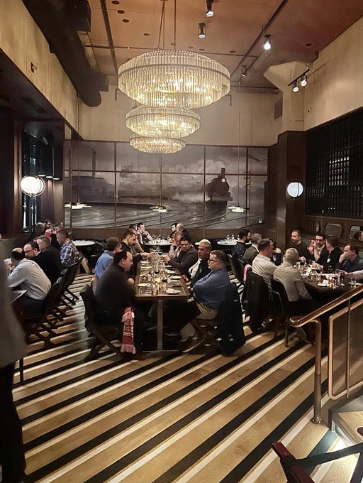 Photo of large dining room with people at tables