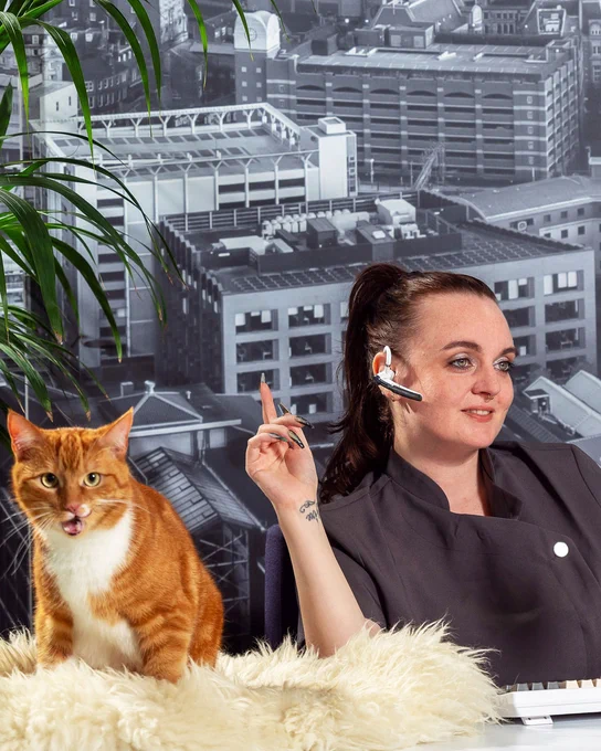 A receptionist and an orange cat