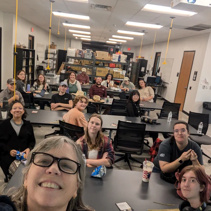 The Archaeology Club members sitting at tables in the Archaeology lab.