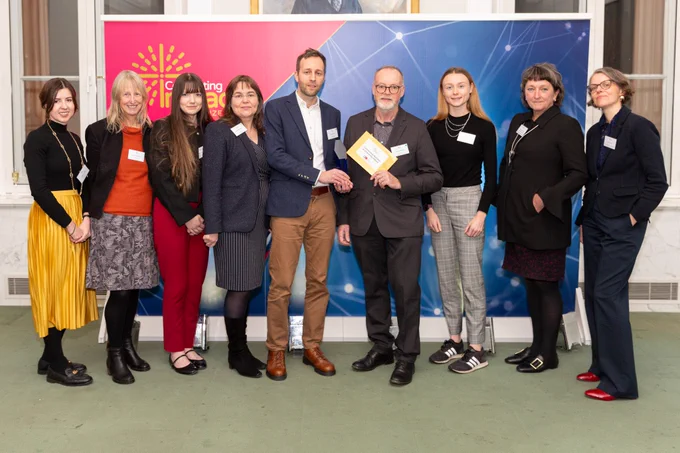 Outstanding Business and Enterprise Impact winner, Professor Brendan Burchell and Dr David Frayne, and the Digit working time reduction team. 

Image credit: Anthony Sajdler