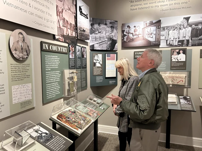 Attendees looking at exhibition