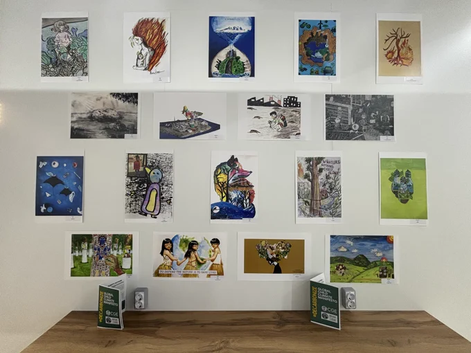 A wall with various artistic pictures in different styles