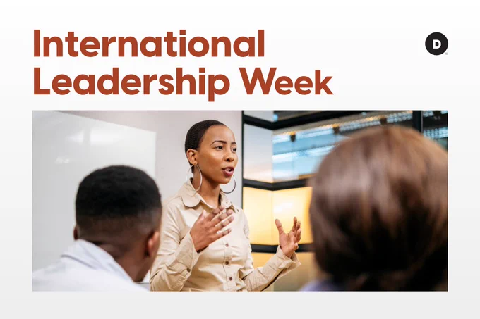Image of a person standing and presenting to a group in a boardroom meeting with text reading, "International Leadership Week."