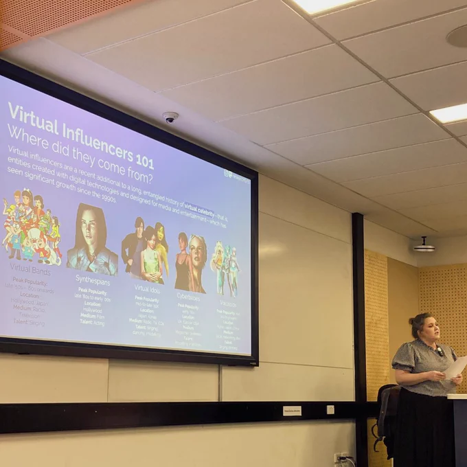 IERLab Research Student Rachel Berryman presenting for the Milestone 3 presentation. The slide shows 'Virtual Infuencers 101: Where did they come from?'