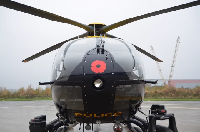 Image of helicopter with poppy on nose. 