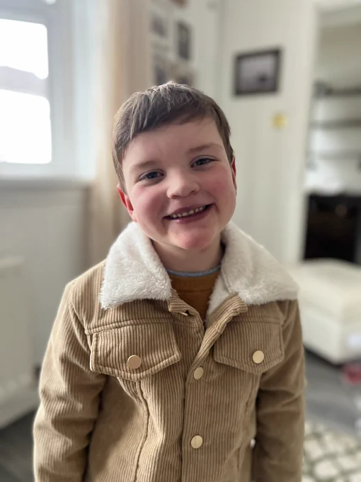 A photos of a smiling Dáithí who is also dressed to impress.