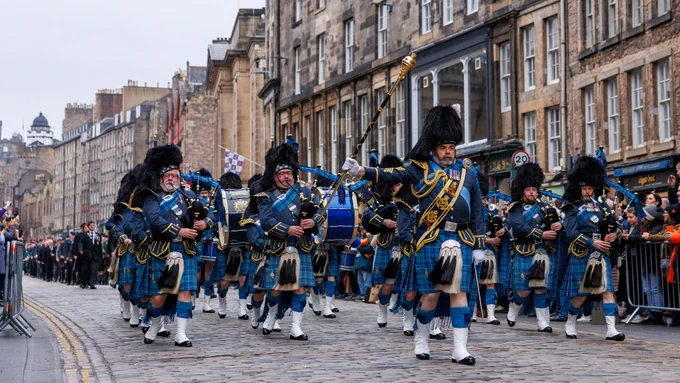 RAF Pipes and drums lead the way through the streets of Edinburgh during this years Remembrance Parade.