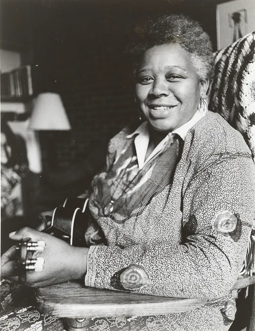 A less often seen black-and-white portrait of Ella Jenkins, smiling and holding ukulele, circa 1970. Photo by Bernadelle Richter, courtesy of the Ella Jenkins Archive.