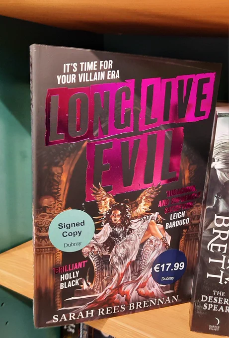 A copy of Long Live Evil by Sarah Rees Brennan on a shelf at Dubray Books on Henry Street, Dublin. Price €17.99. Blue sticker says "Signed Copy".