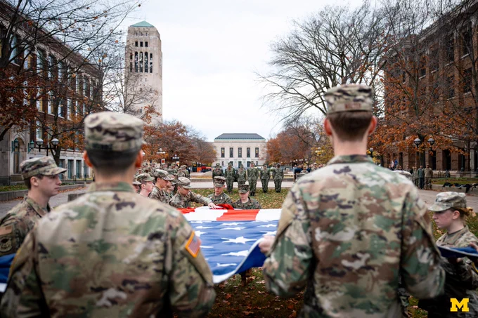U-M ROTC members unravel the flag on the Diag.
