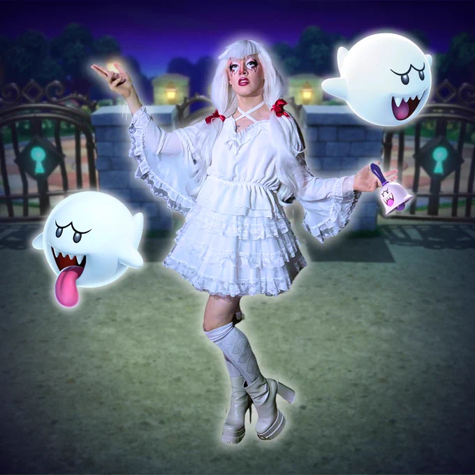 Aria Zero dressed in a casual cosplay of Boo from Mario, holding a Boo Bell and posed next to 2 Boos! She's tired of stealing stars but still serving diva. 
