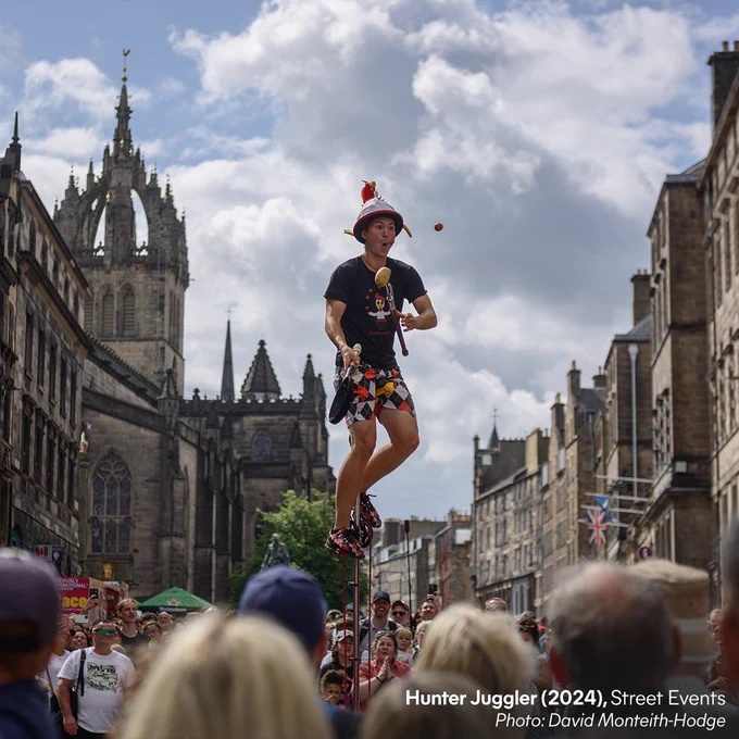 Street performer Hunter Juggler performs atop a unicycle at the 2024 Fringe street events. Photo: David Monteith-Hodge.
