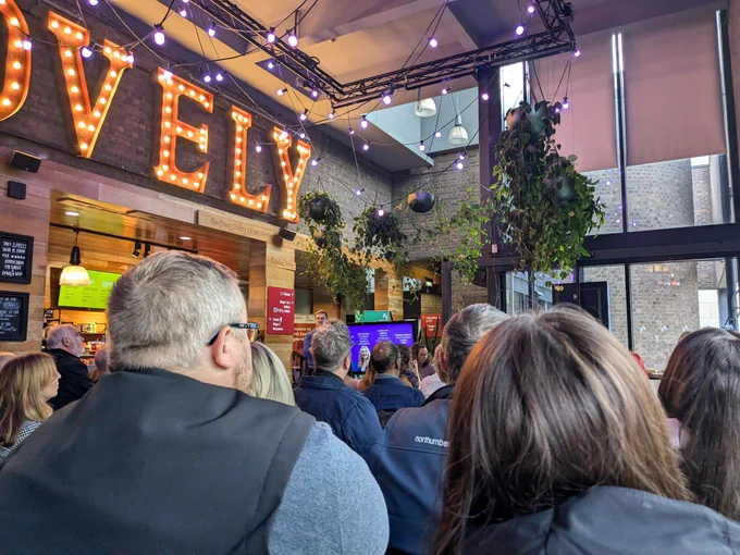 Group of people watching a presentation at Northern Stage for Purple Tuesday event 