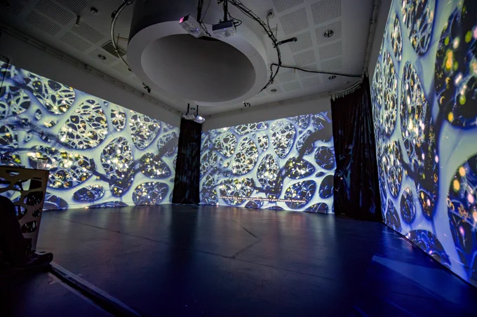 Water Portals exhibition, lights and projections on white walls