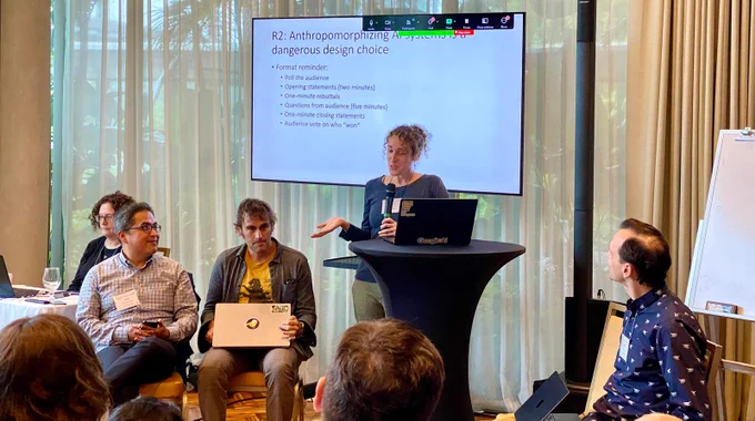 Merrie, Amy, Andres, Michael, and Jeff discussing whether anthropomorphizing AI systems is a dangerous design choice. 