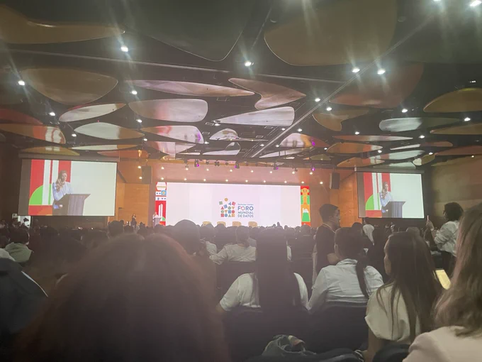 Large stage with a video screen behind it