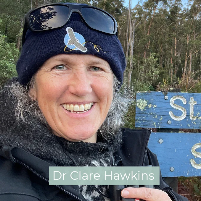 Dr Clare Hawkins standing out in nature and smiling