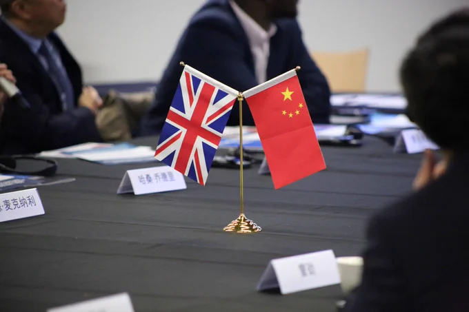 A table decoration of the flags of the UK and China.