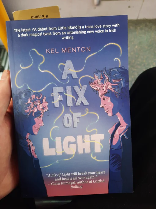 A Fix of Light by Kel Menton. Purple and pink cover featuring two boys, the protagonists of the story. 