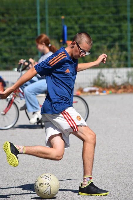 A player doing a football trick.