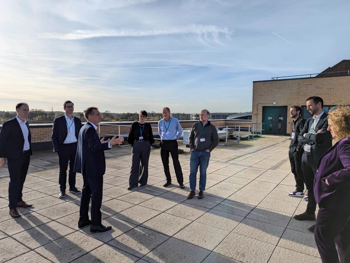 The delegation speak on the roof of the Institute of Safe Autonomy