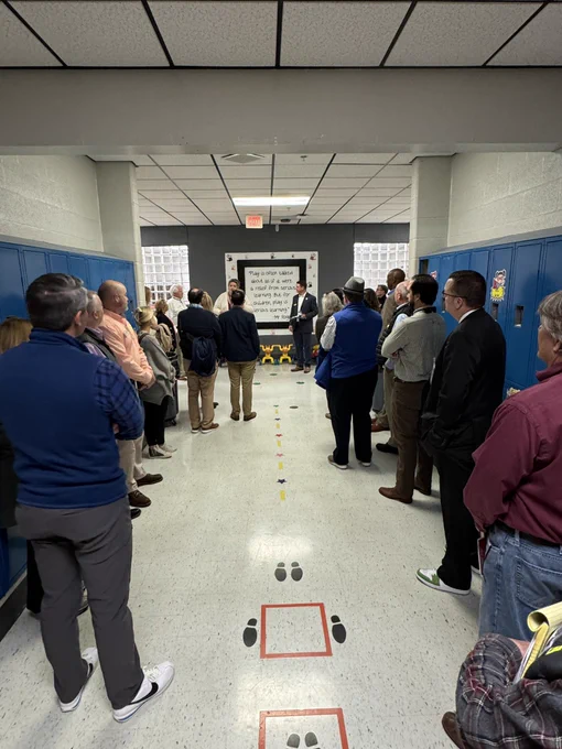 Group of adults in school hallway