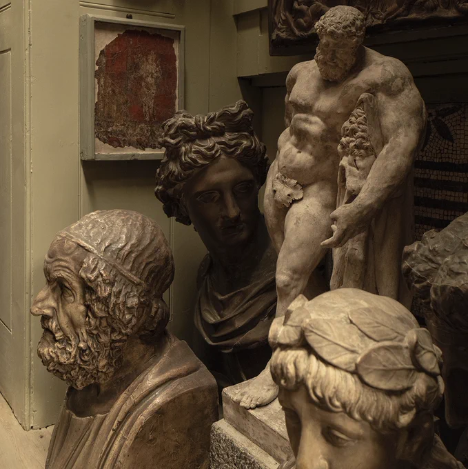 An arrangement of busts and sculptures, clustered together in a corner of the Lobby to the Breakfast Room.
