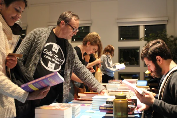 Attendees browse books at the Publication Party.