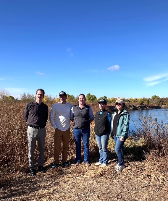 Assemblymember Papan pictured with representatives of River Partners with the river behind. 