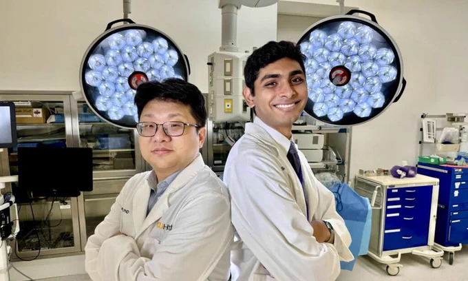 A diverse group of researchers at Virginia Commonwealth University (VCU) collaborating in a laboratory setting, showcasing innovative medical devices and technologies aimed at advancing cancer treatments and road safety solutions

