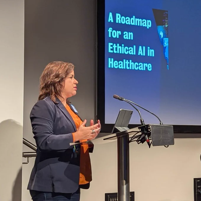 Sara Cedes speaking at lectern