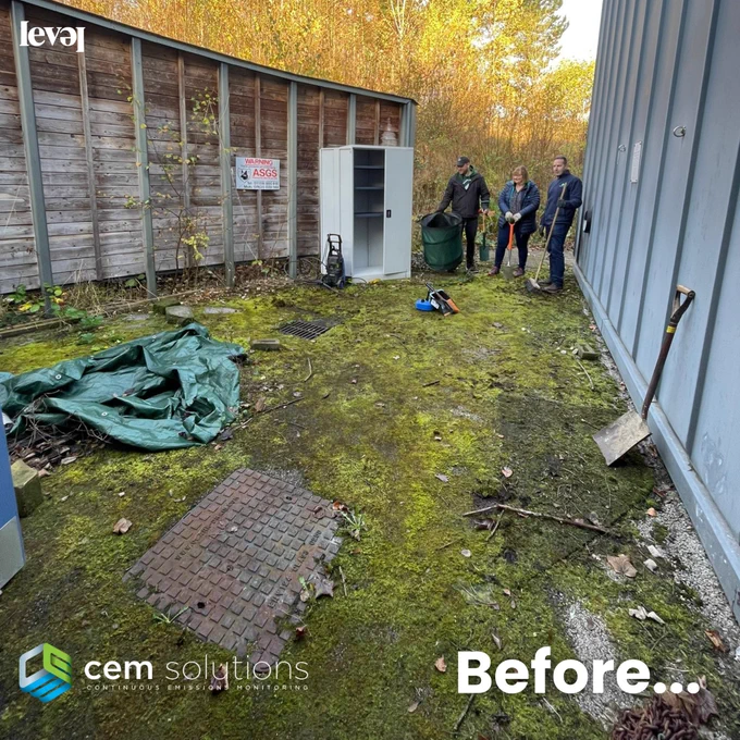 A messy outdoor courtyard area, flanked with a grey zinc clad building wall on one side and a wooden curved fence on the other. The floor is covered in moss and it's messy. There is a grey cupboard and a green tarpaulin in the courtyard area. Three people look as if they are about to start cleaning the area up. The CEM Solutions logo in green, blue and white sits at the bottom of the screen. White text reads Before...