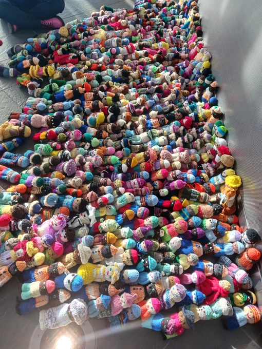 Large pile of crocheted dolls