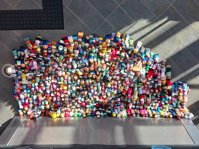Large pile of crocheted dolls