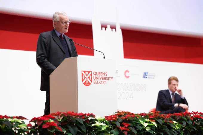 Secretary of State Hilary Benn addresses the Global Innovation Summit at Queen's University Belfast, as Joe Kennedy III listens.