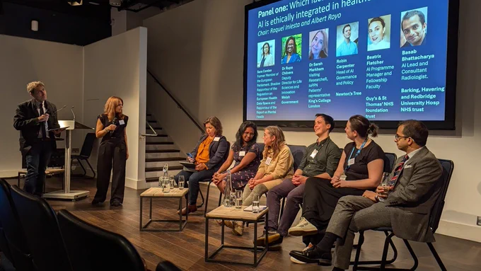 Row of people in a panel discussion