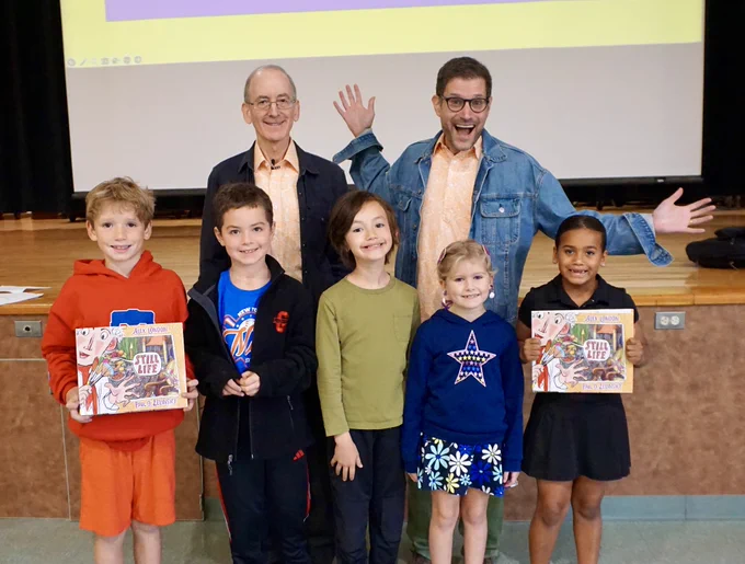 Zelinksy and London pose for a picture with five smiling Gladwyne students!